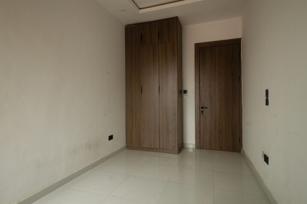 Brum Height 4: Built-in wardrobes in an unfurnished bedroom